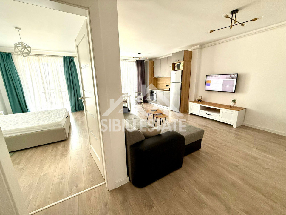 Apartament de inchiriat cu 2 camere, balcon, loc de parcare-mobilat si utilat