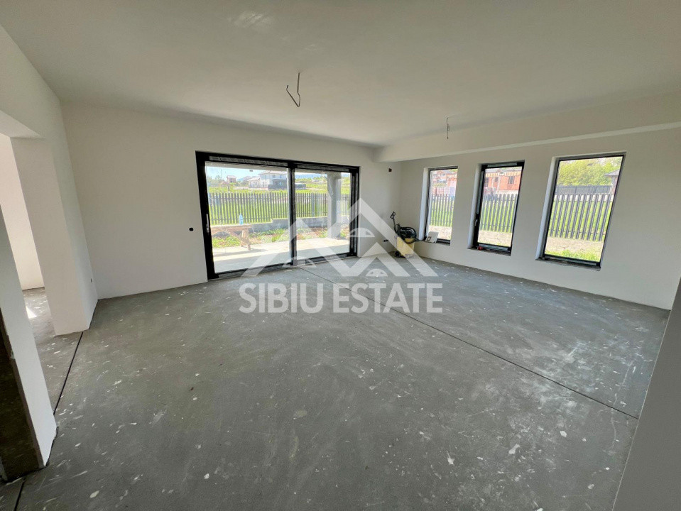 Casa individuala generoasa 5 camere, carport si pivnita curte 500 mp 
